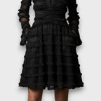 Parisa – Vestido midi con flecos transparentes